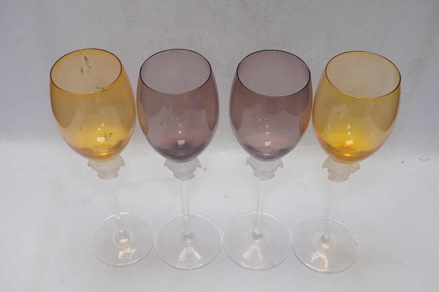 Four boxed Rosenthal for Versace Medusa head wine glasses in various colours, 26cm high. Condition - good.